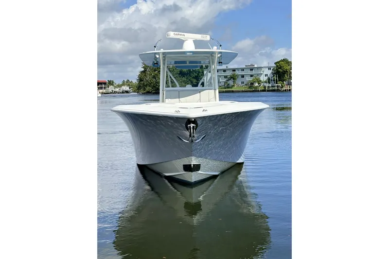 Slide: The Image of 2017 SeaVee 370Z boat on calm water, front view, clear sky background. - 6