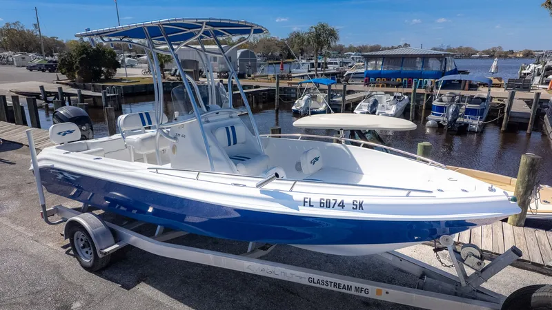 Slide: The Image of 2019 Glasstream 221cc boat on trailer at marina. - 3