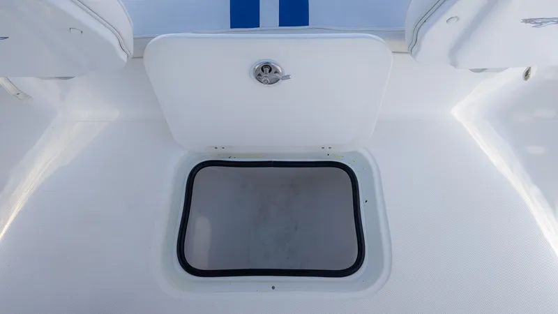 Slide: The Image of Glasstream 221cc 2019 boat hatch with open storage compartment. - 7