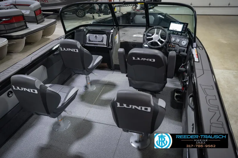 Slide: The Image of Interior of 2026 Lund 1975 Tyee boat with four seats and modern dashboard. - 13
