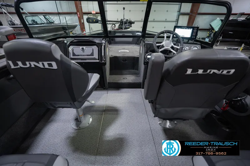 Slide: The Image of Interior of 2026 Lund 1975 Tyee boat with dual seats and modern dashboard. - 16
