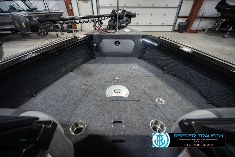 Slide: The Image of Interior of 2026 Lund 1975 Tyee boat with carpeted deck and fishing equipment. - 17