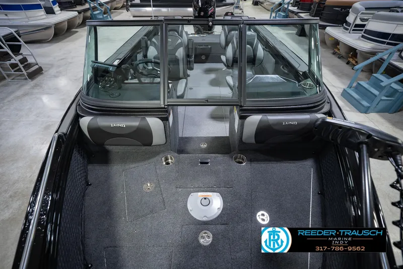 Slide: The Image of Interior view of 2026 Lund 1975 Tyee boat in showroom setting. - 18