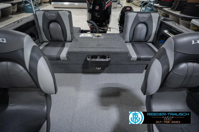 Slide: The Image of 2026 Lund 1975 Tyee boat interior with gray seating and cup holders. - 20