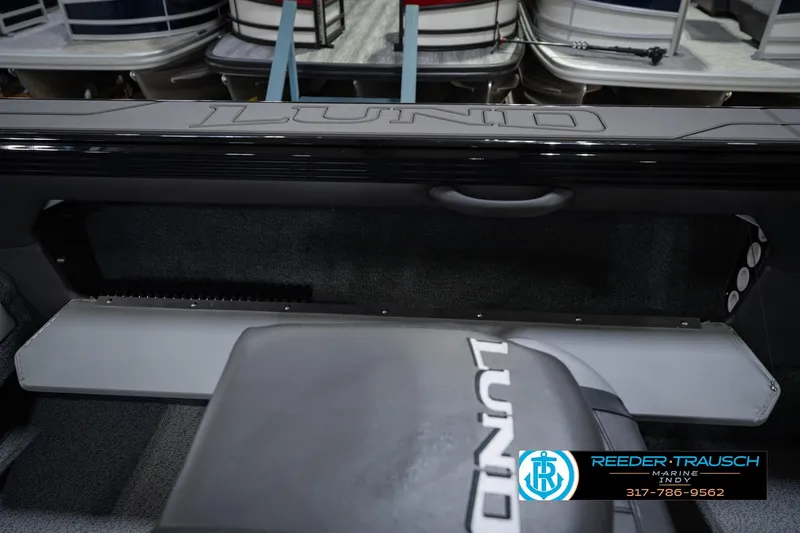 Slide: The Image of Interior view of 2026 Lund 1975 Tyee boat, featuring seating and storage area. - 25