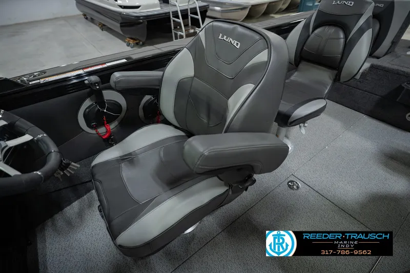 Slide: The Image of 2026 Lund 1975 Tyee boat interior with comfortable seating and modern design. - 27