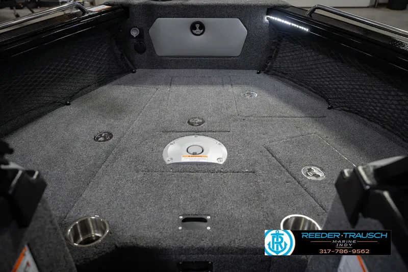 Slide: The Image of Interior of 2026 Lund 1975 Tyee boat with carpeted flooring and storage compartments. - 28