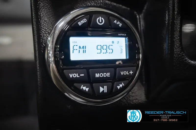 Slide: The Image of Close-up of a digital radio display in a 2026 Lund 1975 Tyee boat. - 32