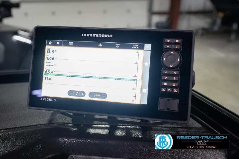 Slide: The Image of Humminbird Xplore 9 fish finder on Lund 1975 Tyee, 2026 model, displayed in a marine setting. - 33