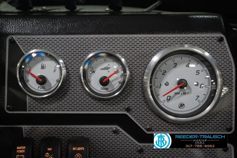 Slide: The Image of Dashboard of 2026 Lund 1975 Tyee boat with fuel, trim, and RPM gauges. - 34
