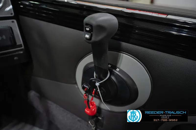 Slide: The Image of Close-up of a 2026 Lund 1975 Tyee boat control panel with gear shift. - 37