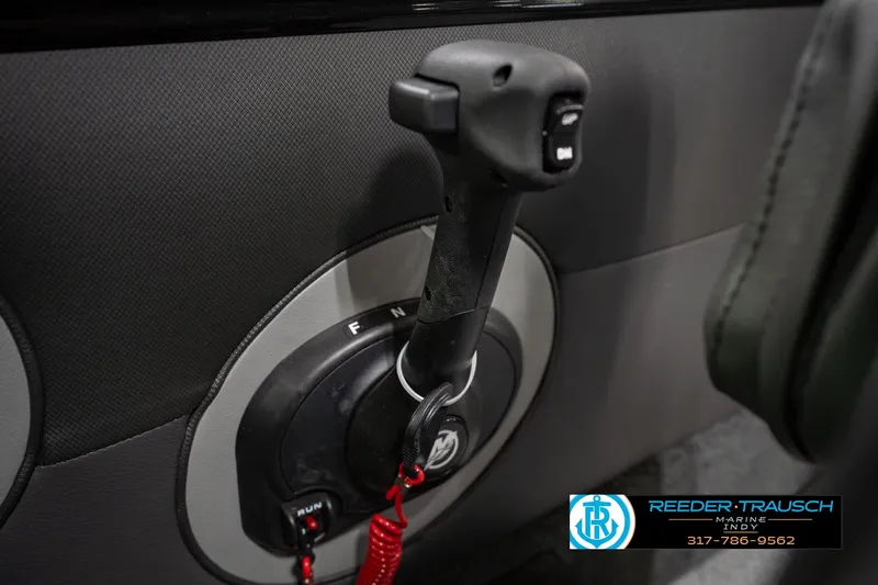 Slide: The Image of Close-up of 2026 Lund 1975 Tyee boat throttle control with branding. - 38
