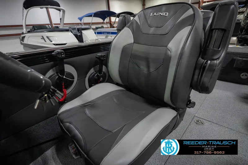 Slide: The Image of Lund 1975 Tyee 2026 boat seat in showroom, featuring sleek design and comfortable upholstery. - 39