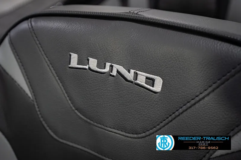 Slide: The Image of Lund 1975 Tyee 2026 boat seat with logo, Reeder Trausch Marine contact info. - 40