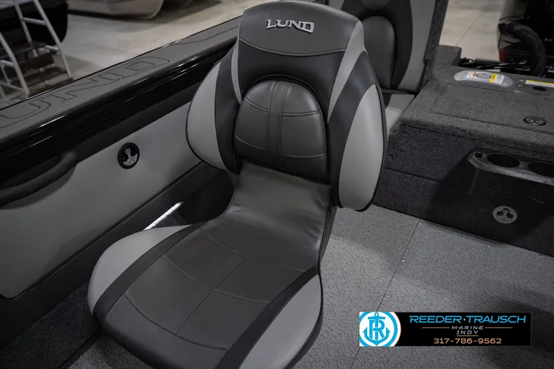 Slide: The Image of Luxurious seating in 2026 Lund 1975 Tyee boat, featuring sleek black and gray design. - 41