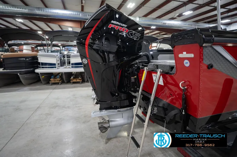 Slide: The Image of 2026 Lund 1975 Tyee boat with Mercury Pro XS engine in showroom. - 48