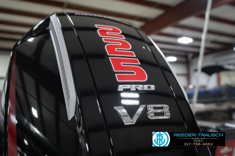 Slide: The Image of Close-up of a 225 Pro V8 engine on a 2026 Lund 1975 Tyee boat. - 50