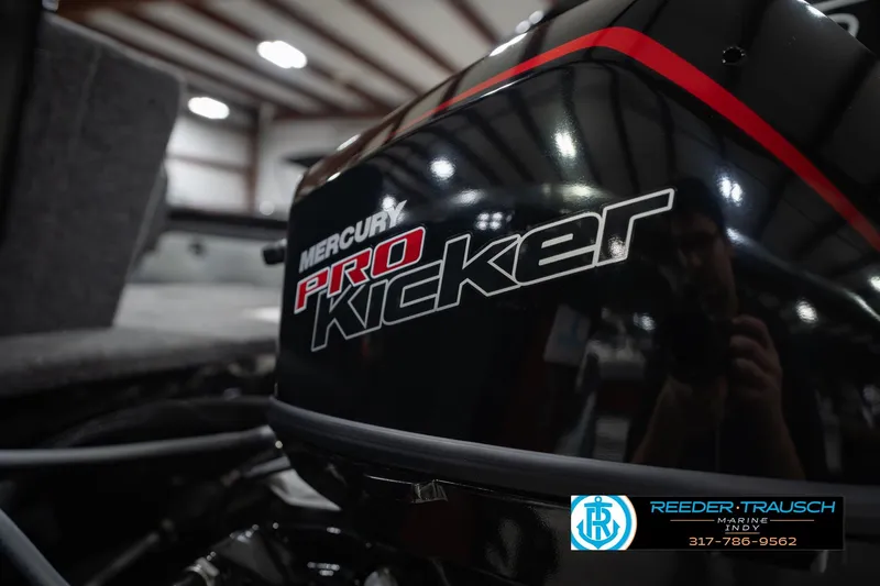 Slide: The Image of Close-up of Mercury Pro Kicker engine on 2026 Lund 1975 Tyee boat. - 54