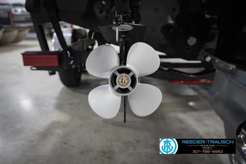 Slide: The Image of Propeller of 2026 Lund 1975 Tyee boat in a showroom setting. - 56