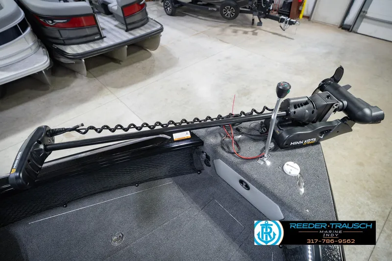 Slide: The Image of 2026 Lund 1975 Tyee boat with Minn Kota trolling motor in showroom. - 57