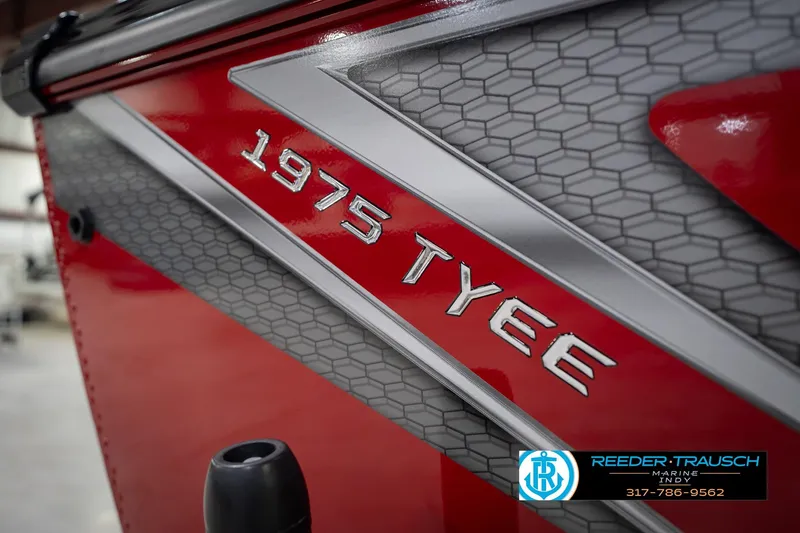 Slide: The Image of Red 2026 Lund 1975 Tyee boat with hexagonal pattern and Reeder-Trausch Marine logo. - 62