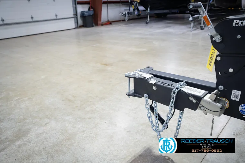 Slide: The Image of Trailer hitch of a 2026 Lund 1975 Tyee in a garage setting. - 64