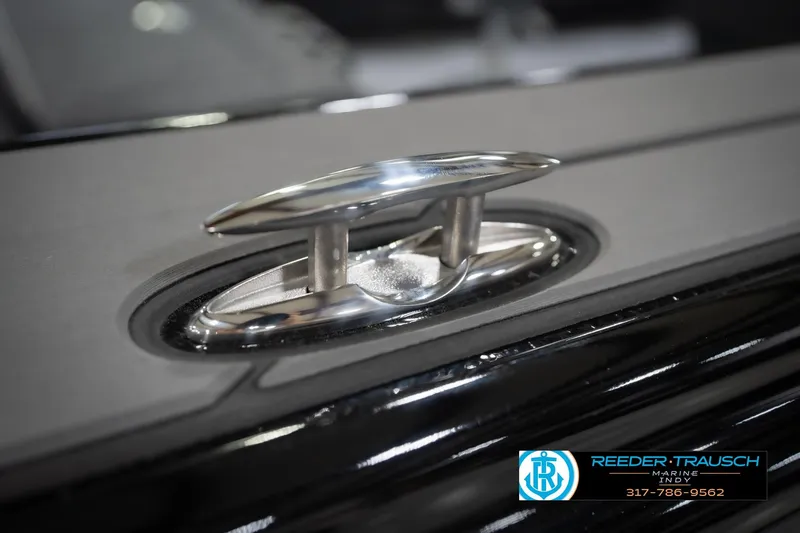 Slide: The Image of Close-up of a 2026 Lund 1975 Tyee boat cleat, featuring sleek metallic design. - 69