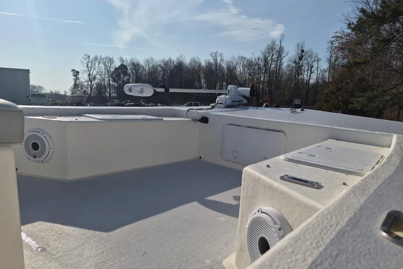 Slide: The Image of 2024 May-Craft 22 Hancock Skiff boat interior with speakers and storage compartments. - 10