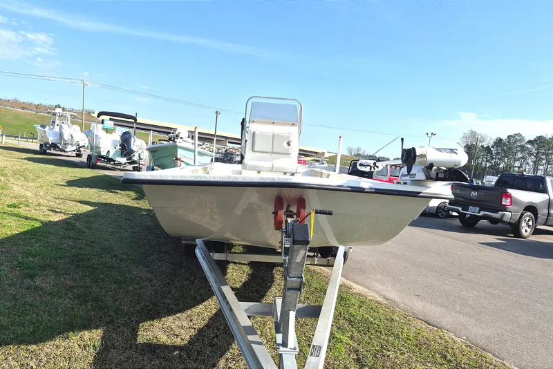 Slide: The Image of 2024 May-Craft 22 Hancock Skiff on trailer, parked outdoors under clear blue sky. - 3