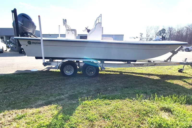 Slide: The Image of 2024 May-Craft 22 Hancock Skiff on trailer, parked outdoors in a sunny setting. - 5