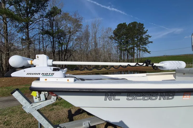 Slide: The Image of 2024 May-Craft 22 Hancock Skiff with Minn Kota trolling motor, parked outdoors. - 7