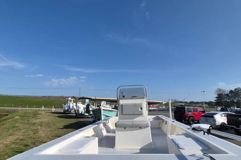 Slide: The Image of 2024 May-Craft 22 Hancock Skiff boat on display under clear blue sky. - 8