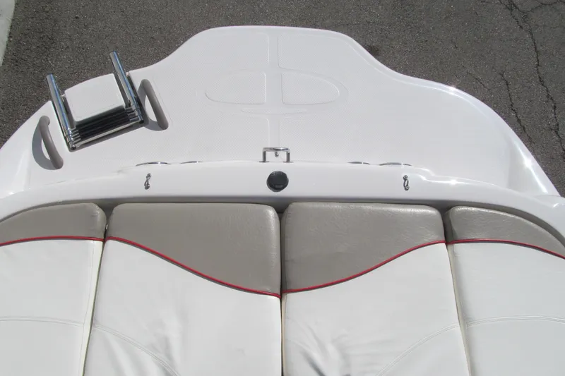 Slide: The Image of 2006 Tahoe Q4 SF boat deck with ladder and cushioned seating. - 13
