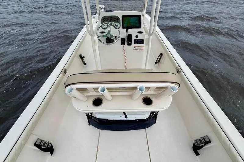 Slide: The Image of 2024 Carolina Skiff 23 LS boat interior with steering console on open water. - 10