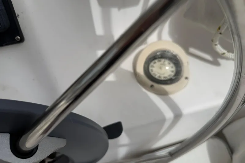 Slide: The Image of Close-up of a 2014 Gemini Legacy 35 boat's steering wheel and compass. - 10