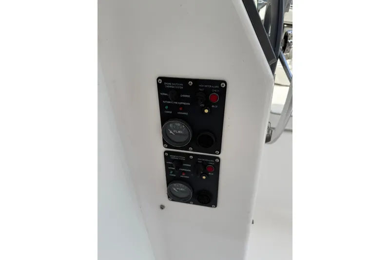 Slide: The Image of Control panel of a 2014 Gemini Legacy 35 boat, featuring fuel and alarm gauges. - 11