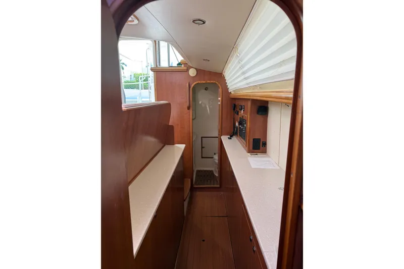Slide: The Image of Interior of 2014 Gemini Legacy 35 sailboat with wood finish and modern amenities. - 15
