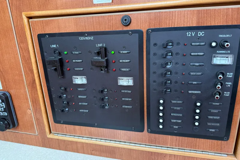 Slide: The Image of Electrical control panel on a 2014 Gemini Legacy 35 boat, featuring switches and indicators. - 18