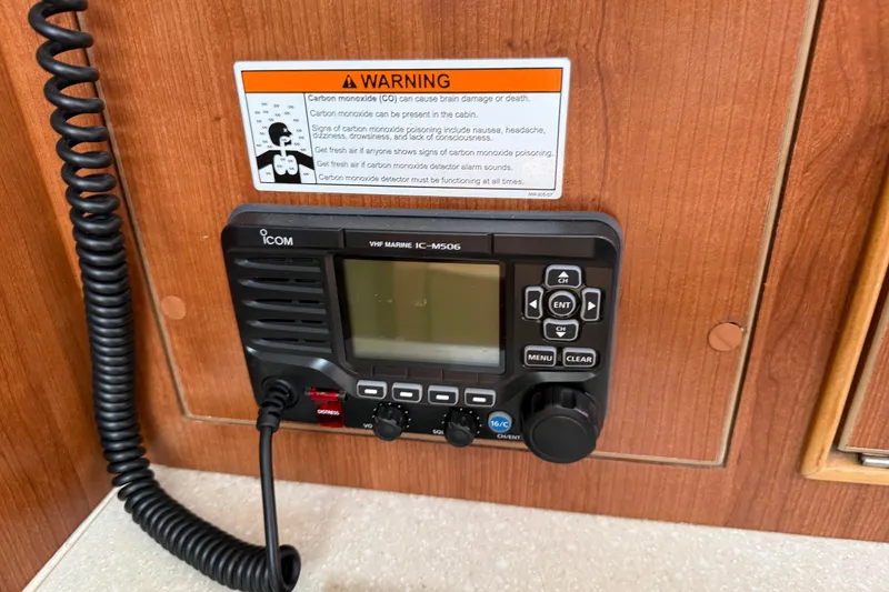 Slide: The Image of VHF marine radio on Gemini Legacy 35, 2014 model, with carbon monoxide warning label. - 19