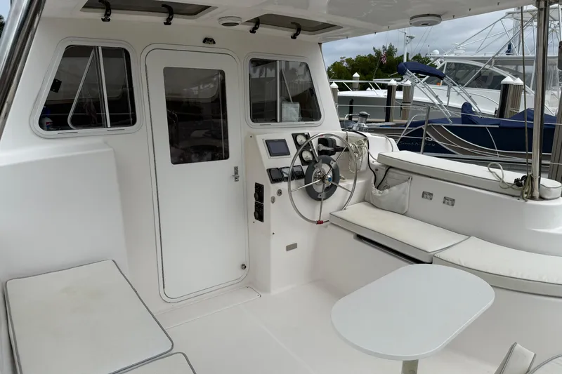 Slide: The Image of Cockpit of 2014 Gemini Legacy 35 catamaran with steering wheel and seating area. - 6