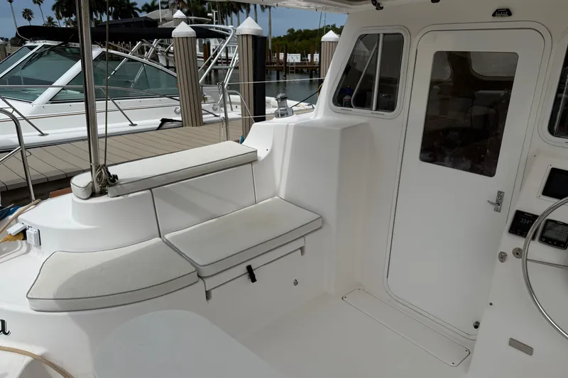 Slide: The Image of Interior view of 2014 Gemini Legacy 35 sailboat cockpit with seating and helm. - 7
