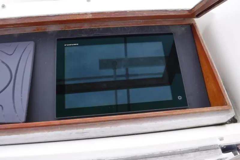 Slide: The Image of Furuno marine display on 1979 Hatteras 46 Convertible yacht dashboard. - 12