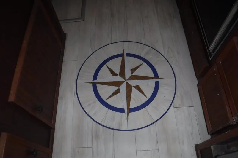 Slide: The Image of Compass rose design on 1979 Hatteras 46 Convertible yacht floor. - 4