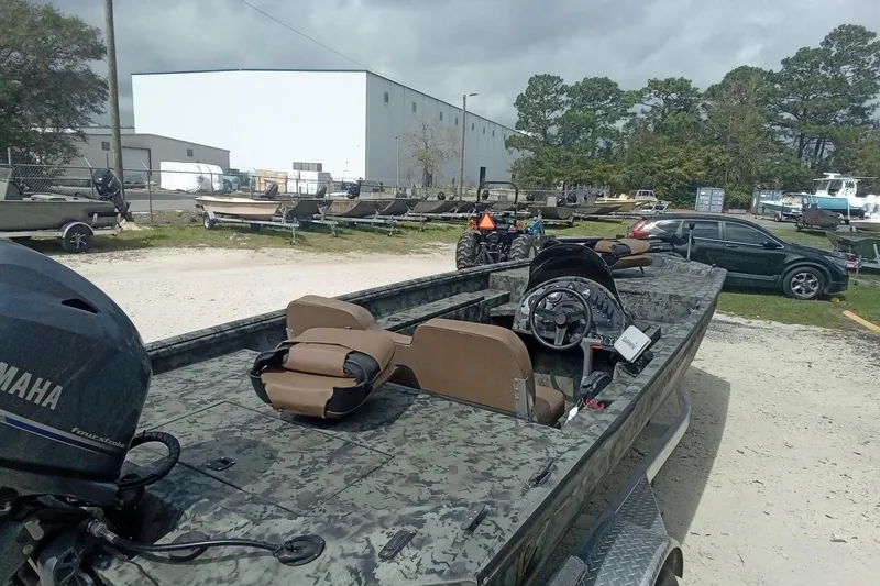 Slide: The Image of 2021 Excel 1860 Stalker SC boat with Yamaha motor in outdoor storage area. - 10