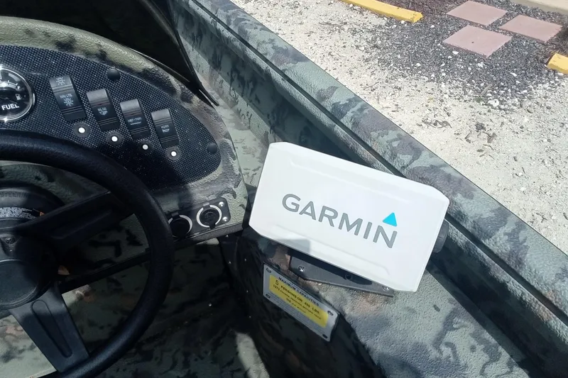 Slide: The Image of 2021 Excel 1860 Stalker SC boat dashboard with Garmin device. - 14