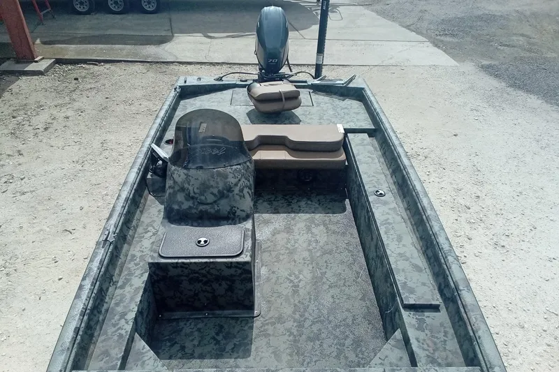 Slide: The Image of 2021 Excel 1860 Stalker SC boat with camouflage design and outboard motor. - 16