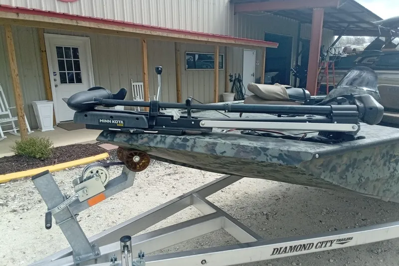 Slide: The Image of 2021 Excel 1860 Stalker SC boat with Minn Kota motor on trailer. - 4