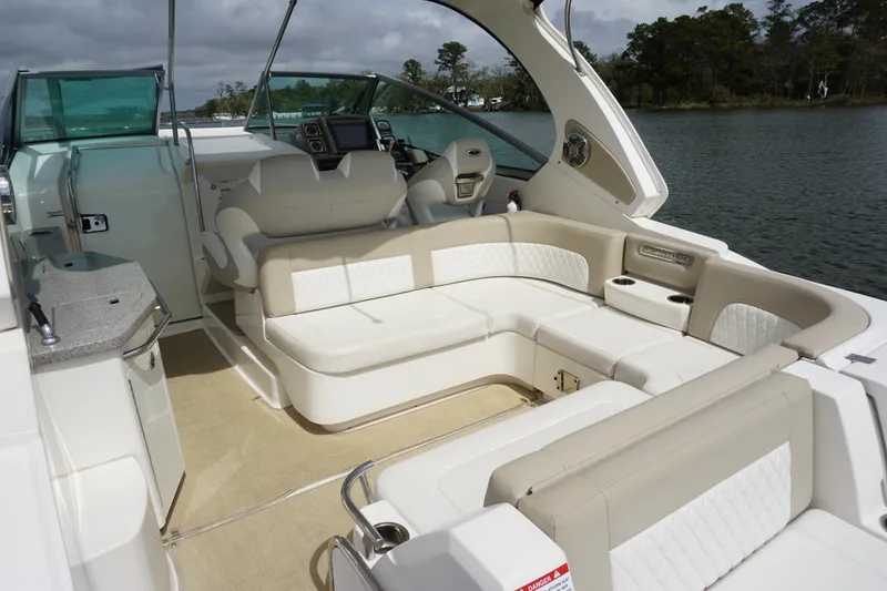 Slide: The Image of Luxurious interior of 2014 Chaparral 330 Signature boat with plush seating and helm. - 12