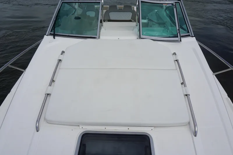 Slide: The Image of 2014 Chaparral 330 Signature boat deck with windshield and seating area. - 17