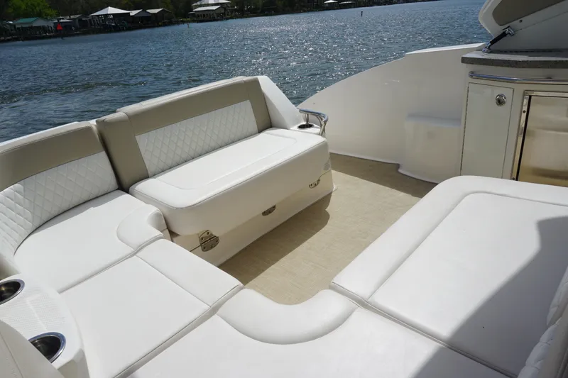 Slide: The Image of 2014 Chaparral 330 Signature boat interior with white seating and water view. - 20